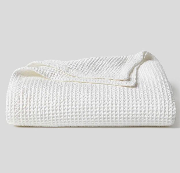 Marathon Stonewashed Bedspread, made of 100% cotton in Europe, shown in white.